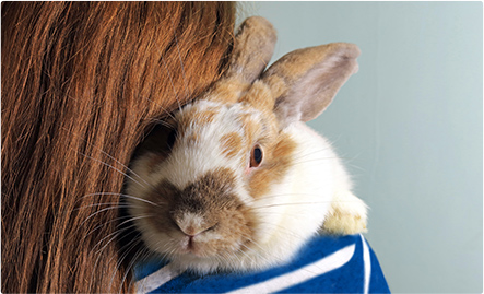 woman holding rabbit